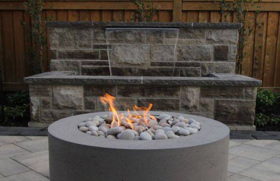 fire and water feature in backyard landscape